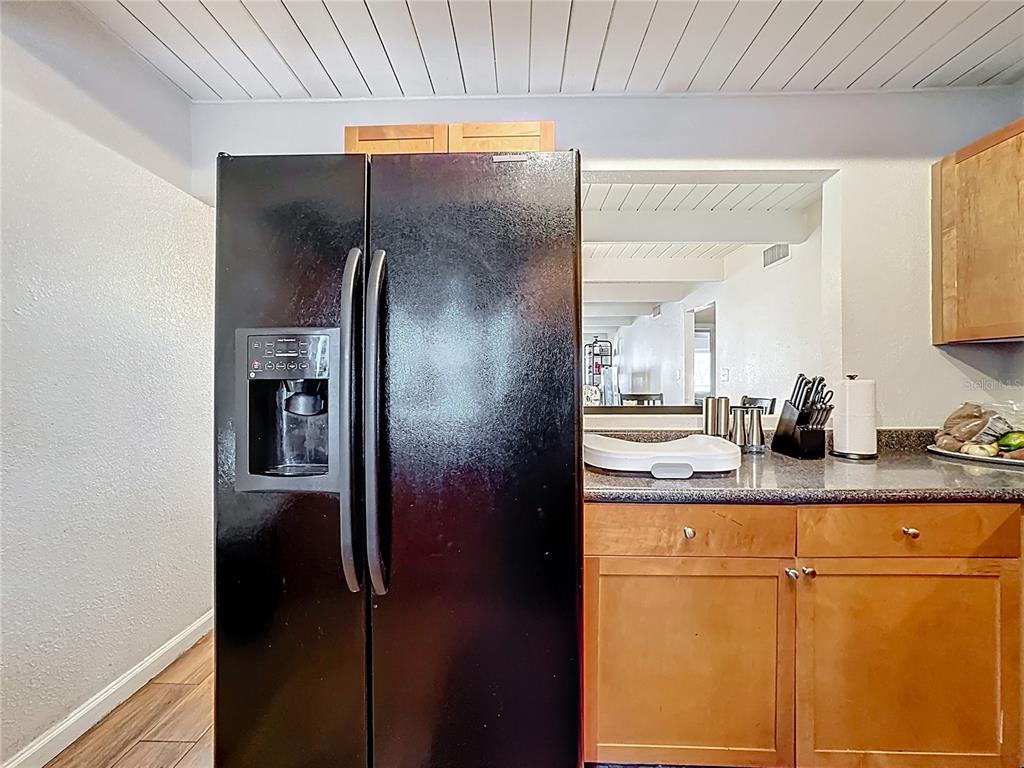 772 East Michigan Street, Unit 70 Orlando, FL 32806 - Photo 15 of 54 a bathroom with a granite countertop sink and a mirror