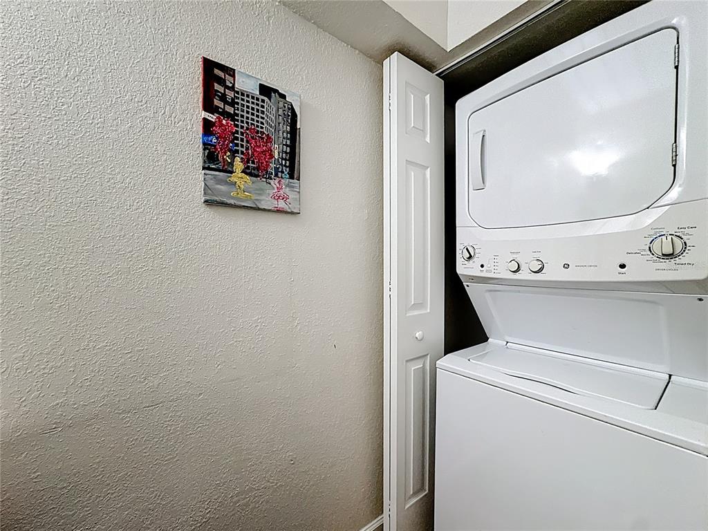 772 East Michigan Street, Unit 70 Orlando, FL 32806 - Photo 27 of 54 a utility room with dryer and washer