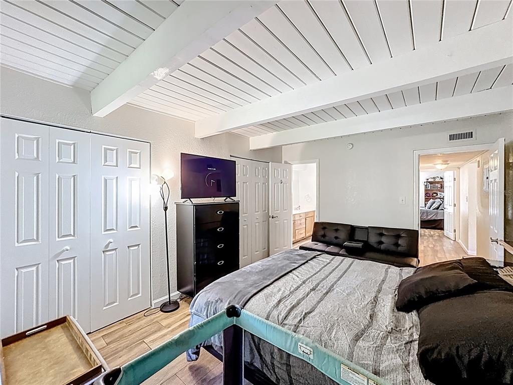 772 East Michigan Street, Unit 70 Orlando, FL 32806 - Photo 29 of 54 a bedroom with a bed and a closet