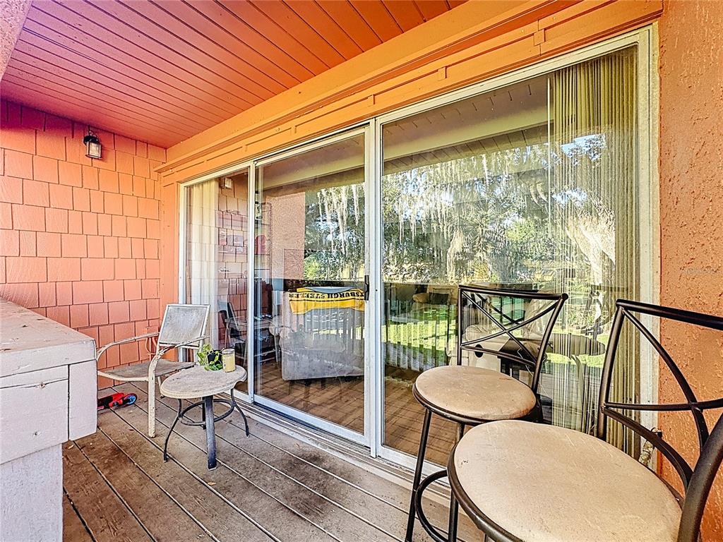 772 East Michigan Street, Unit 70 Orlando, FL 32806 - Photo 39 of 54 a living room with furniture and a window