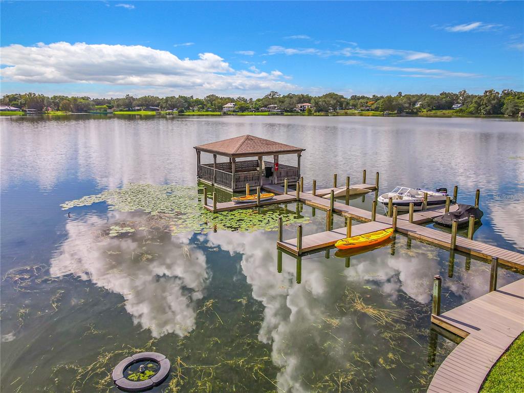 772 East Michigan Street, Unit 70 Orlando, FL 32806 - Photo 5 of 54 a view of a lake with a table and chairs
