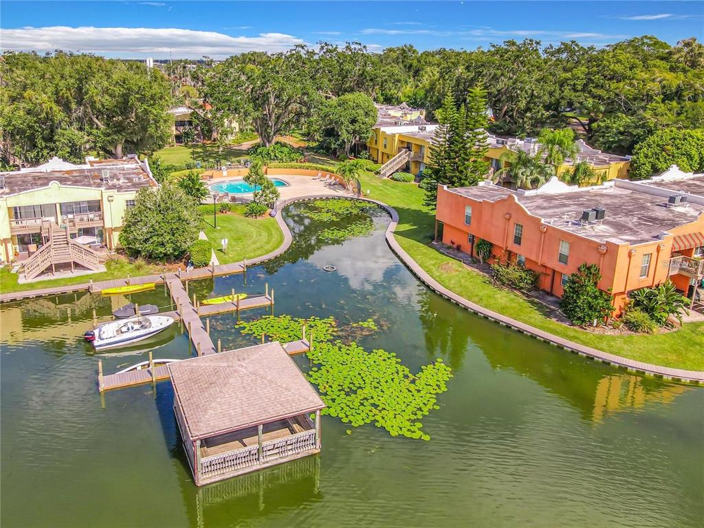 772 East Michigan Street, Unit 70 Orlando, FL 32806 - Photo 7 of 54 an aerial view of a house with outdoor space swimming pool and lake view