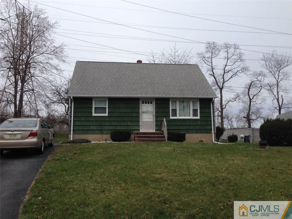 6 Roberts Road New Brunswick, NJ 08901 - Photo 1 of 1 a front view of a house with a garden