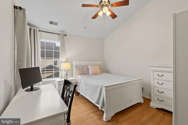 a bedroom with a bed and with furniture