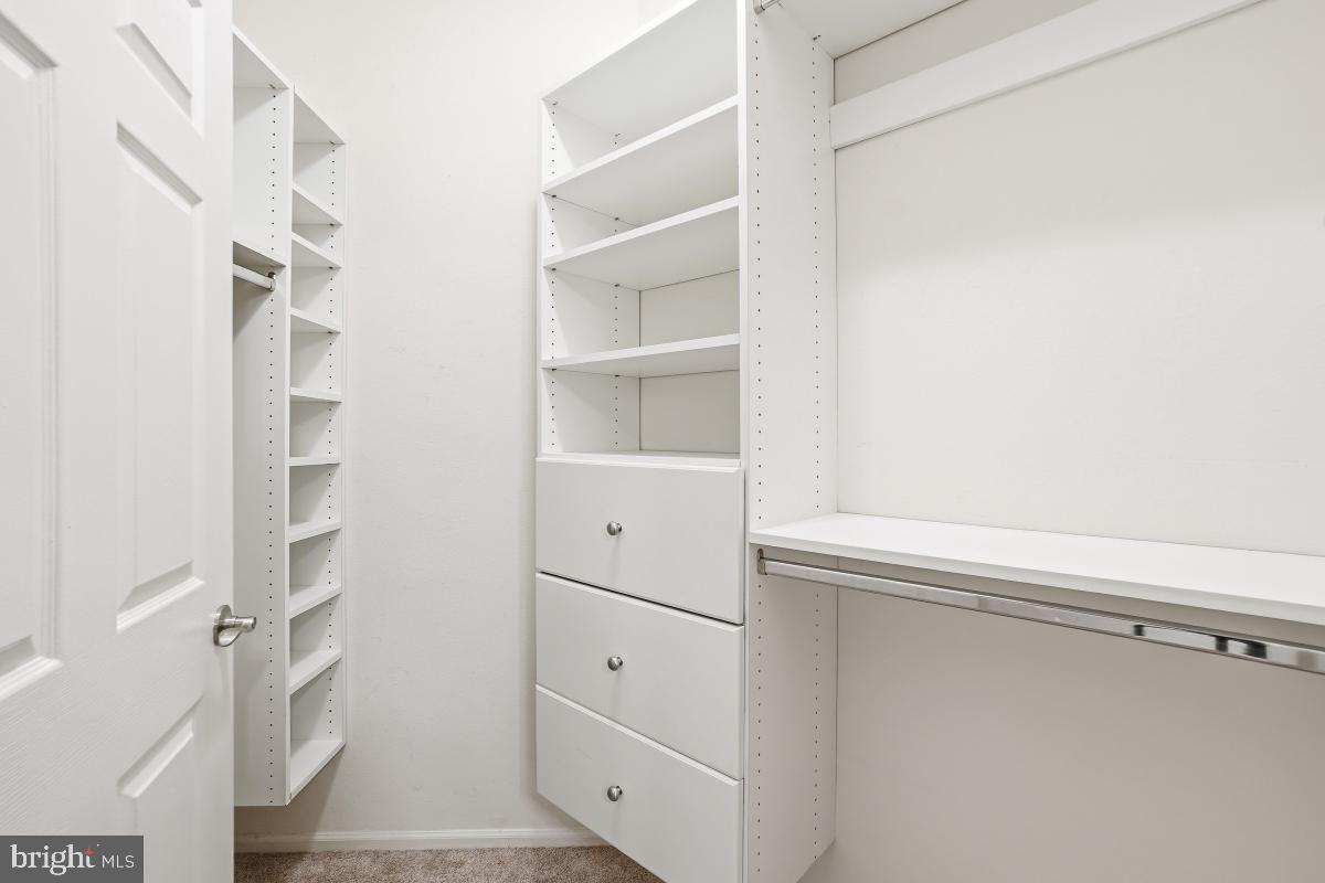 11800 Old Georgetown Road, Unit 1323 North Bethesda, MD 20852 - Photo 19 of 42 a view of walk in closet with empty racks