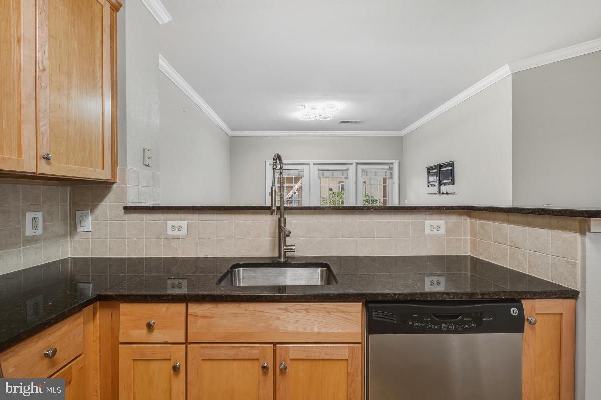 11800 Old Georgetown Road, Unit 1323 North Bethesda, MD 20852 - Photo 6 of 42 a kitchen with granite countertop a sink and cabinets