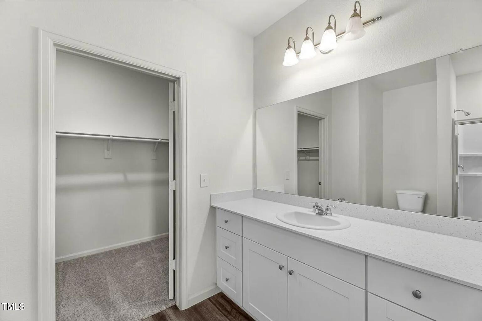 170 Bedstone Way Clayton, NC 27520 - Photo 14 of 22 a bathroom with a double vanity sink and a mirror