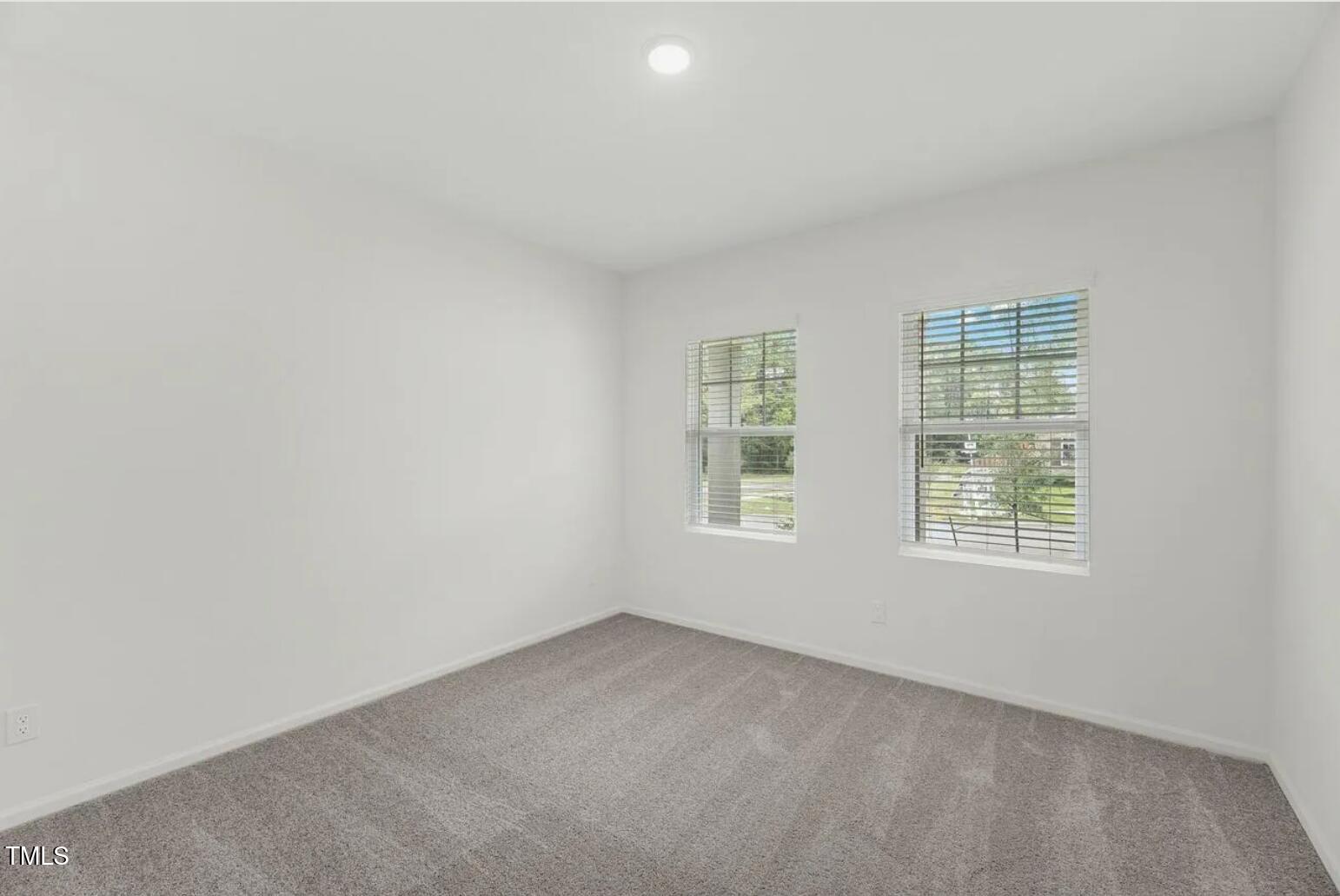 170 Bedstone Way Clayton, NC 27520 - Photo 8 of 22 an empty room with a window