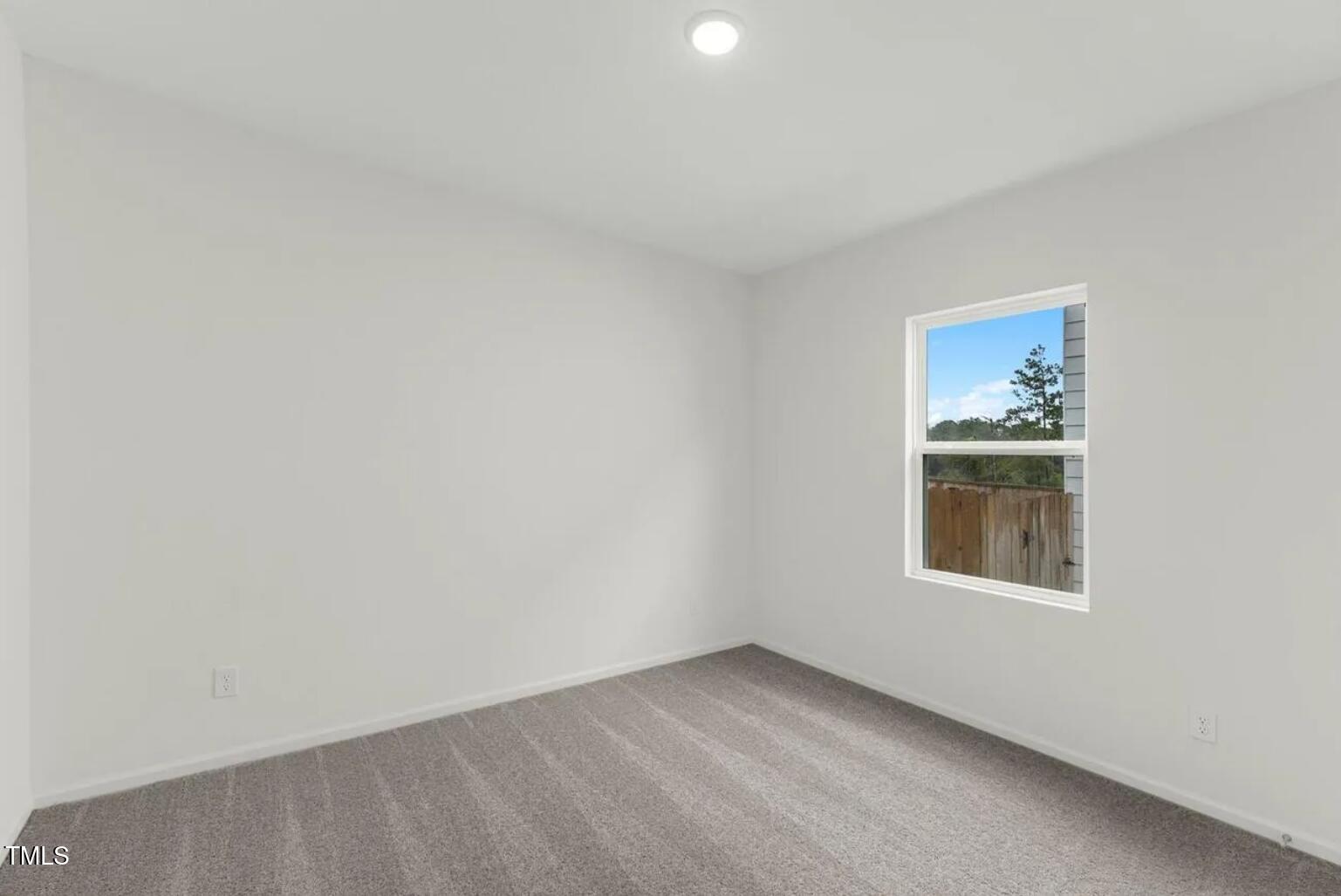 170 Bedstone Way Clayton, NC 27520 - Photo 9 of 22 an empty room with a window