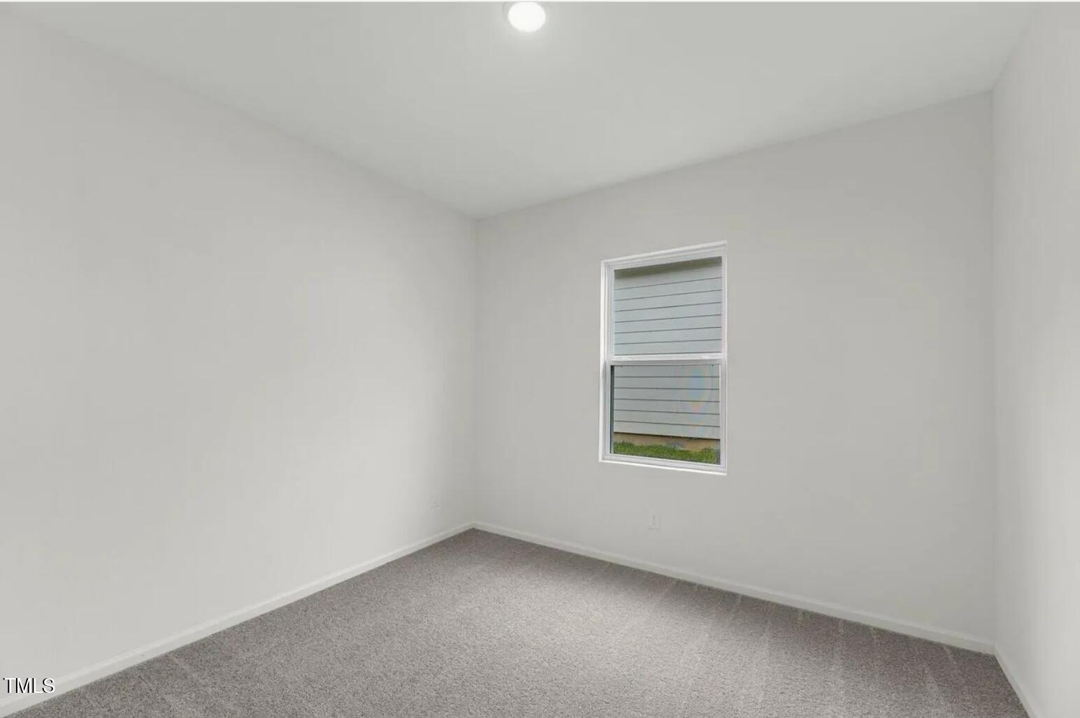170 Bedstone Way Clayton, NC 27520 - Photo 10 of 22 an empty room with a window