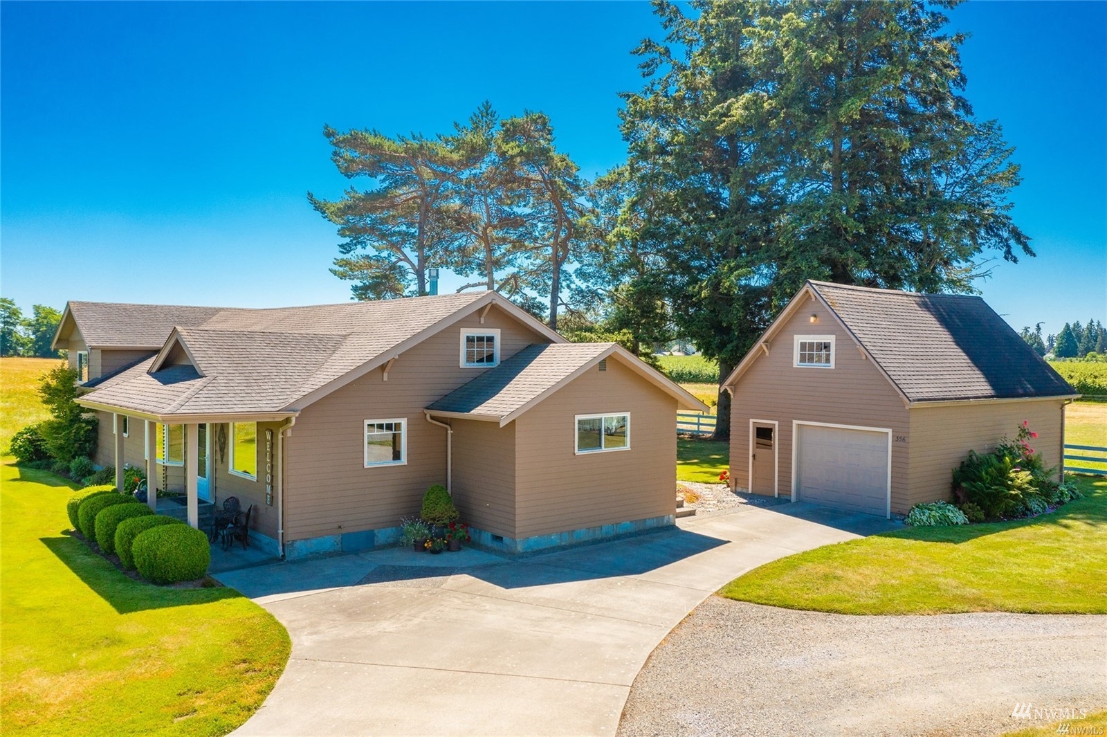 356 East Pole Road Lynden, WA 98264 - Photo 2 of 40 a front view of a house with a yard and garage