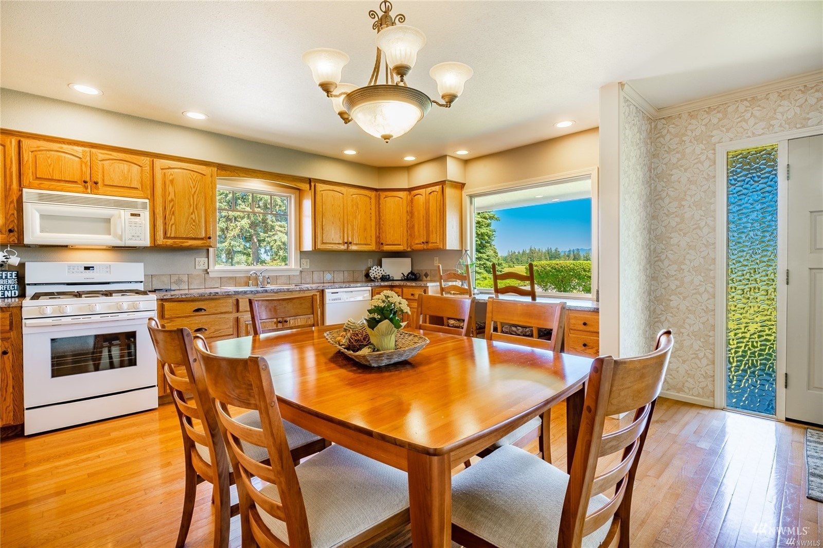 356 East Pole Road Lynden, WA 98264 - Photo 10 of 40 a view of a dining room with furniture window and wooden floor