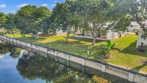 a view of a swimming pool with a patio and yard