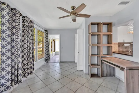 a view of a storage & utility room with cabinets