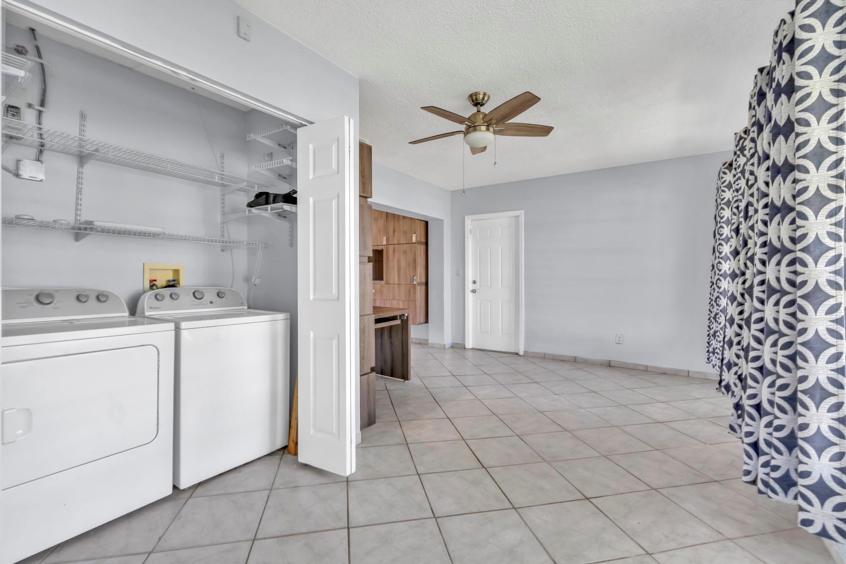 7115 Northwest 73rd Street Tamarac, FL 33321 - Photo 19 of 46 a view of a storage & utility room with cabinets