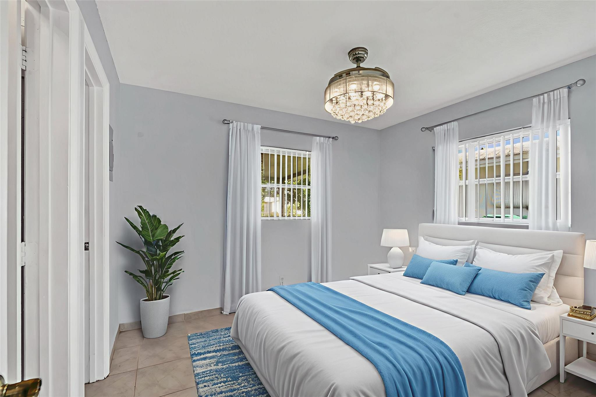 7115 Northwest 73rd Street Tamarac, FL 33321 - Photo 21 of 46 a bedroom with a bed and a window