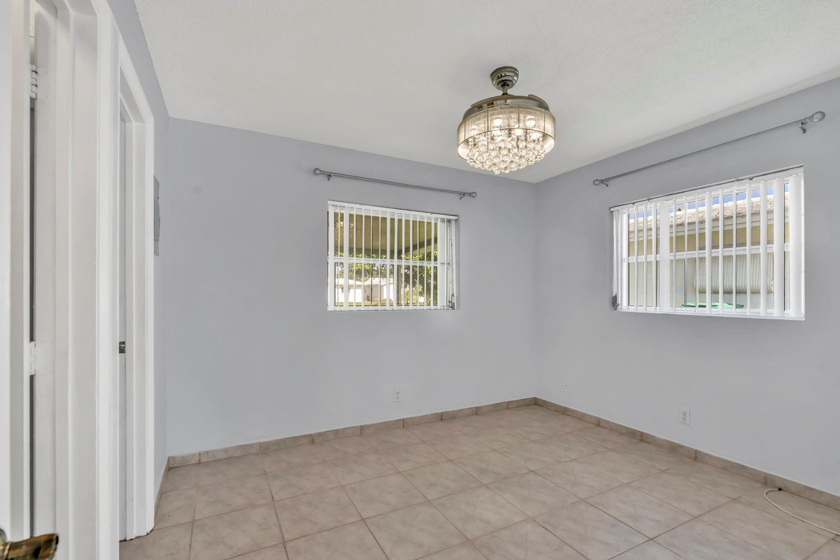 7115 Northwest 73rd Street Tamarac, FL 33321 - Photo 22 of 46 an empty room with a window