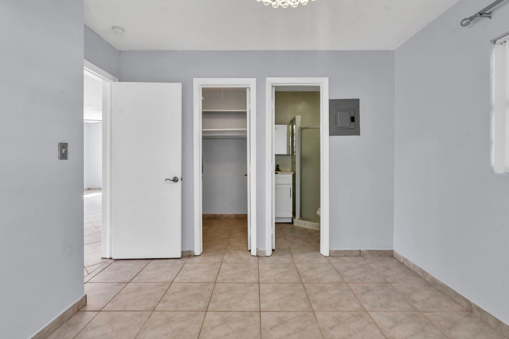 7115 Northwest 73rd Street Tamarac, FL 33321 - Photo 23 of 46 an empty room with closet