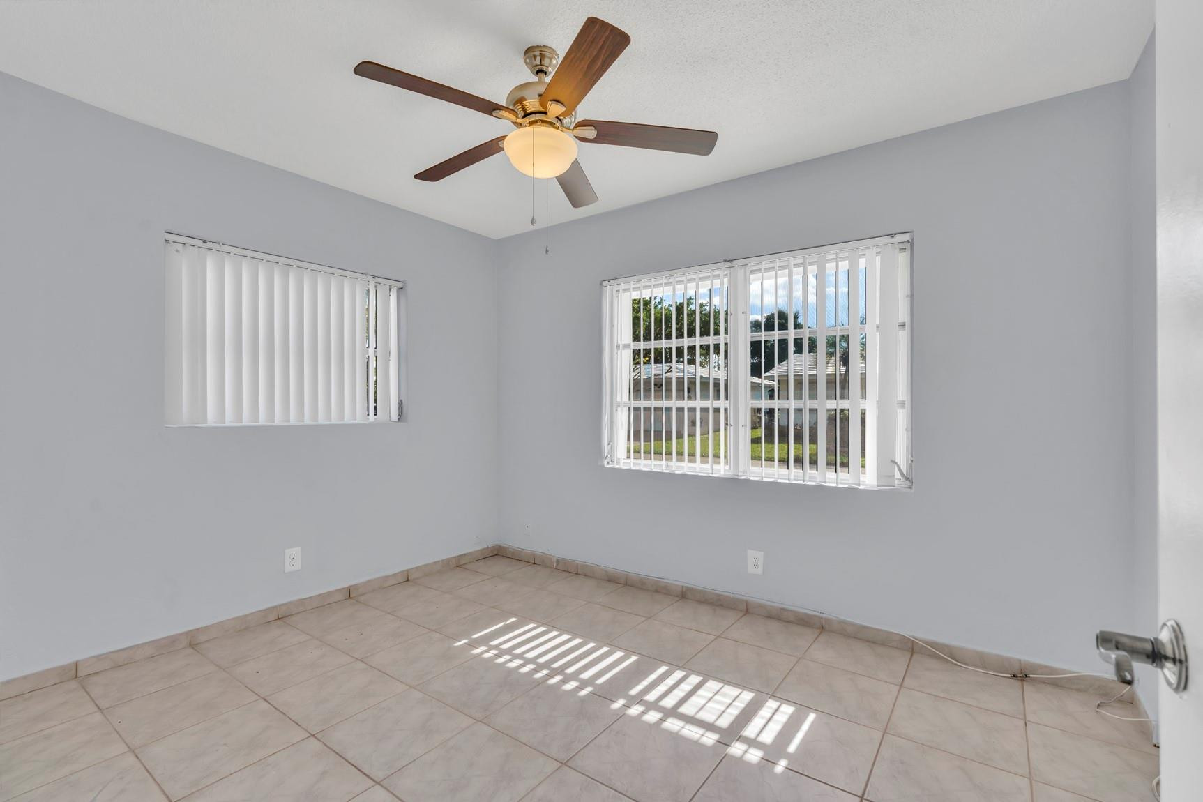 7115 Northwest 73rd Street Tamarac, FL 33321 - Photo 26 of 46 a view of an empty room with a window