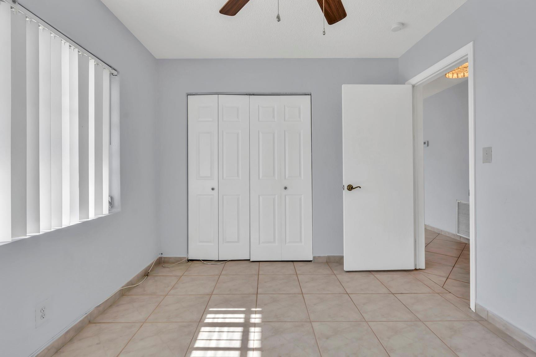 7115 Northwest 73rd Street Tamarac, FL 33321 - Photo 27 of 46 a view of an empty room and window