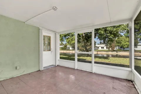 a view of a room with a large window