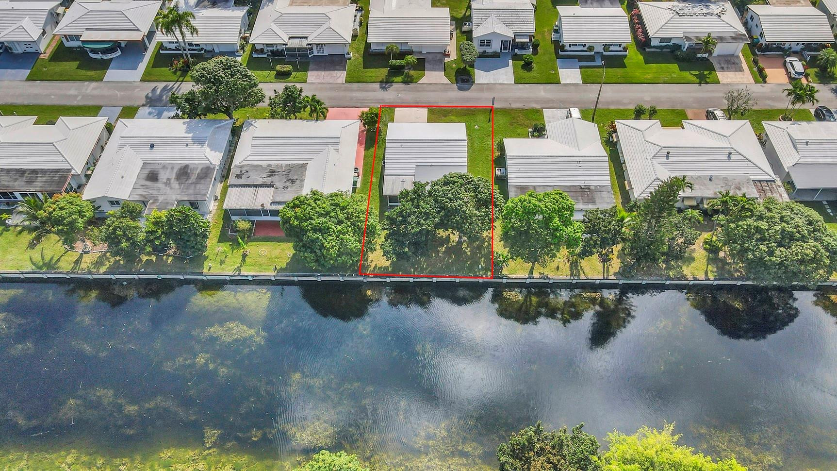 7115 Northwest 73rd Street Tamarac, FL 33321 - Photo 37 of 46 an aerial view of a house with a yard basket ball court and outdoor seating