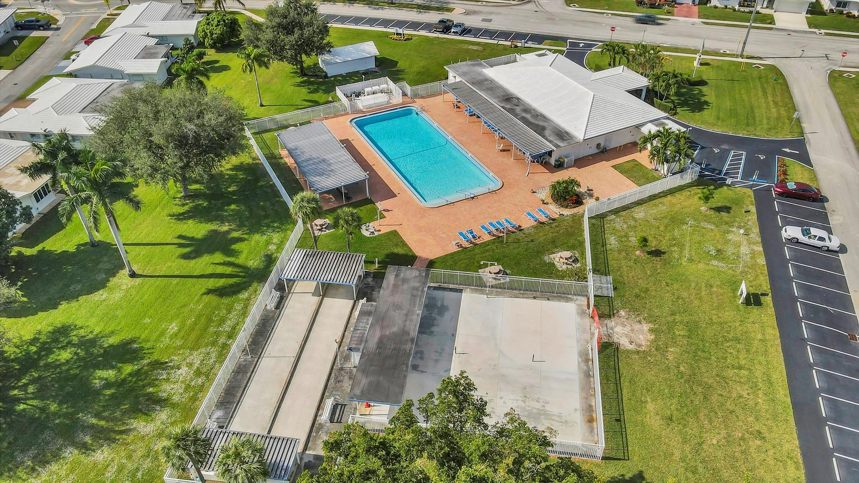7115 Northwest 73rd Street Tamarac, FL 33321 - Photo 39 of 46 an aerial view of a house with outdoor space and a lake view