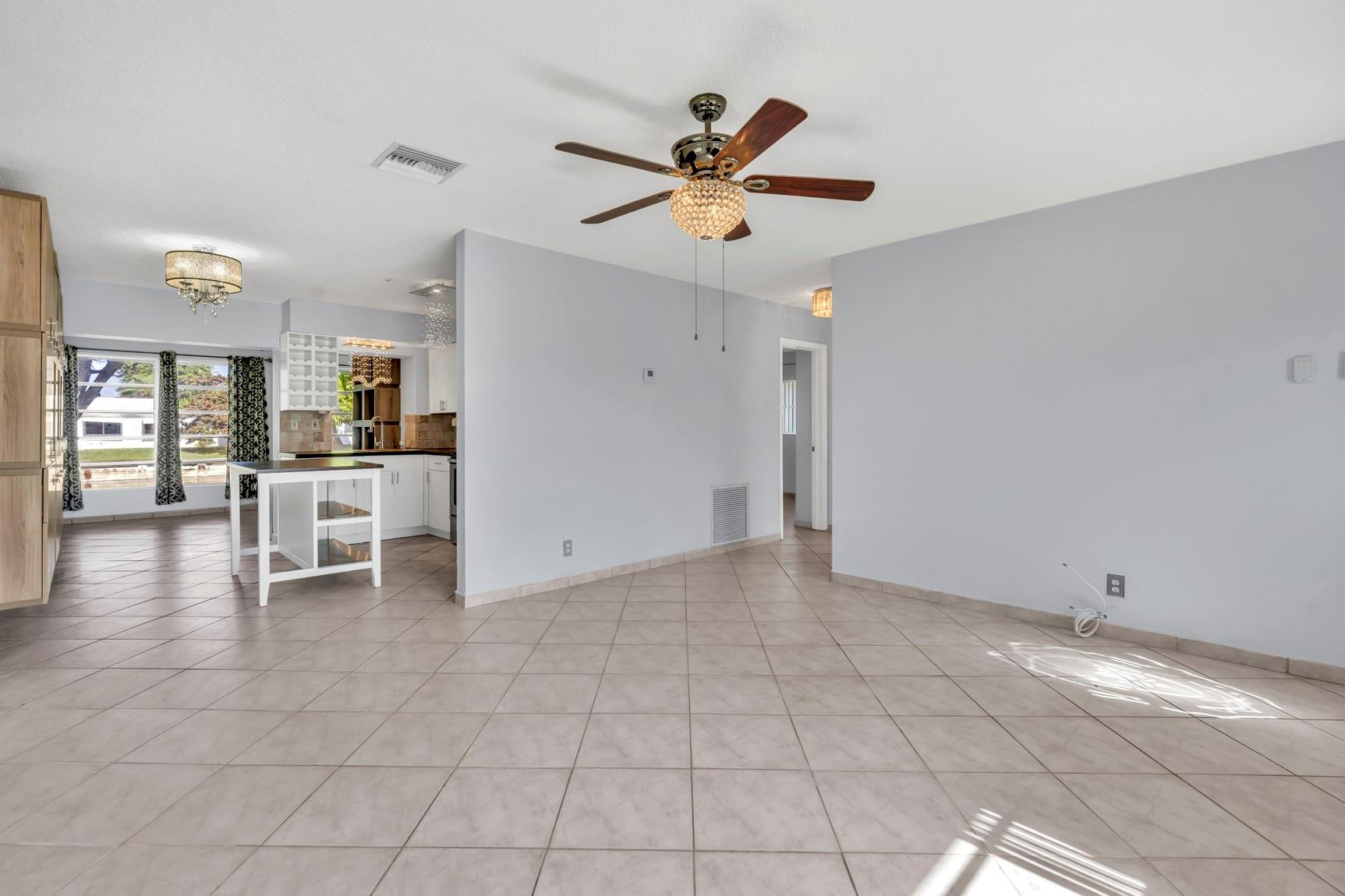 7115 Northwest 73rd Street Tamarac, FL 33321 - Photo 9 of 46 a view of an empty room and window