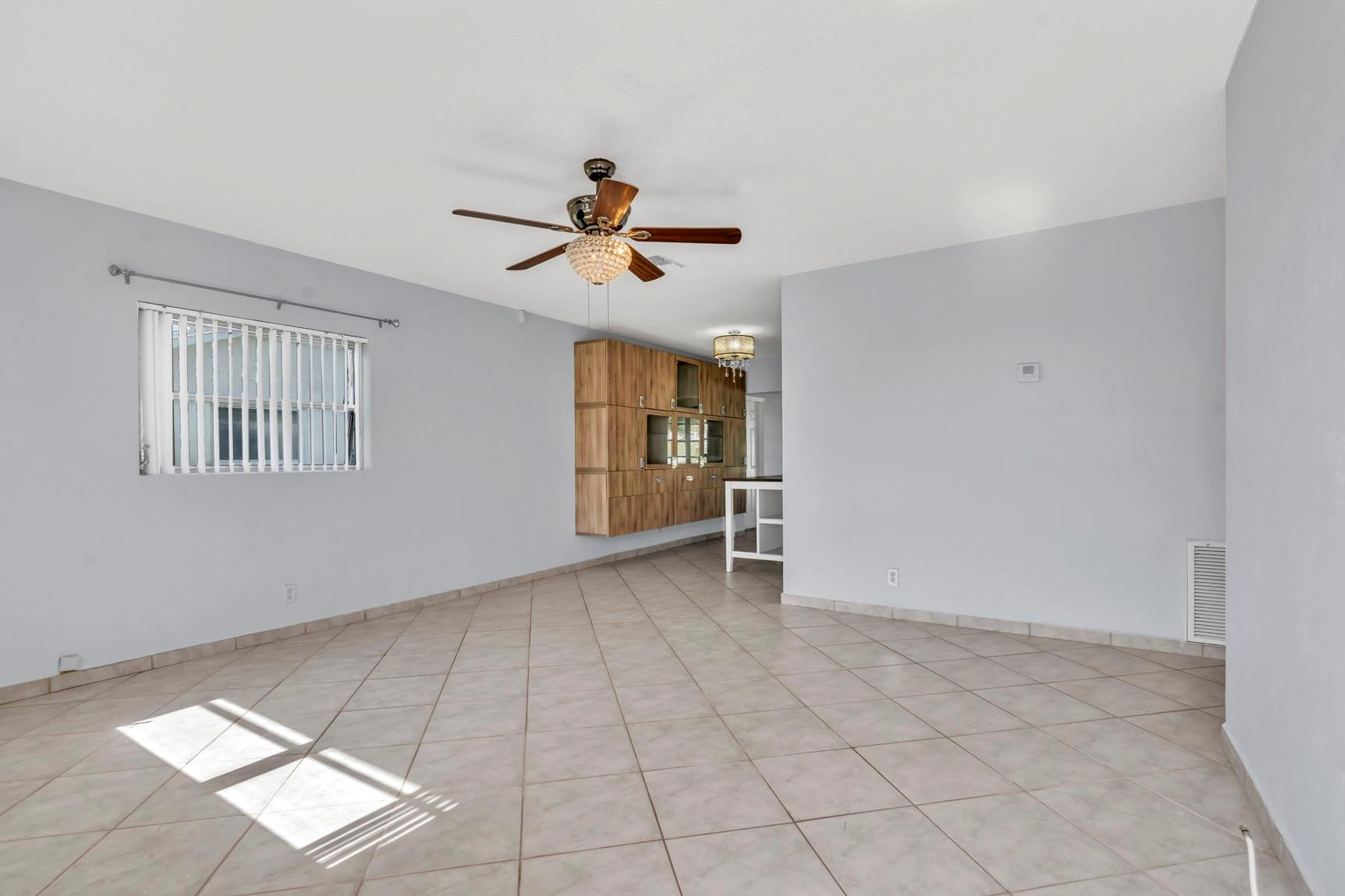 7115 Northwest 73rd Street Tamarac, FL 33321 - Photo 10 of 46 a view of room with a ceiling fan