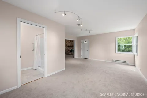 a view of an empty room with a window