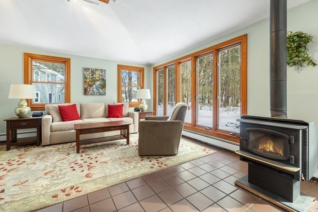 6 Sherman's Bridge Road Wayland, MA 01778 - Photo 12 of 42 a living room with furniture and a fireplace
