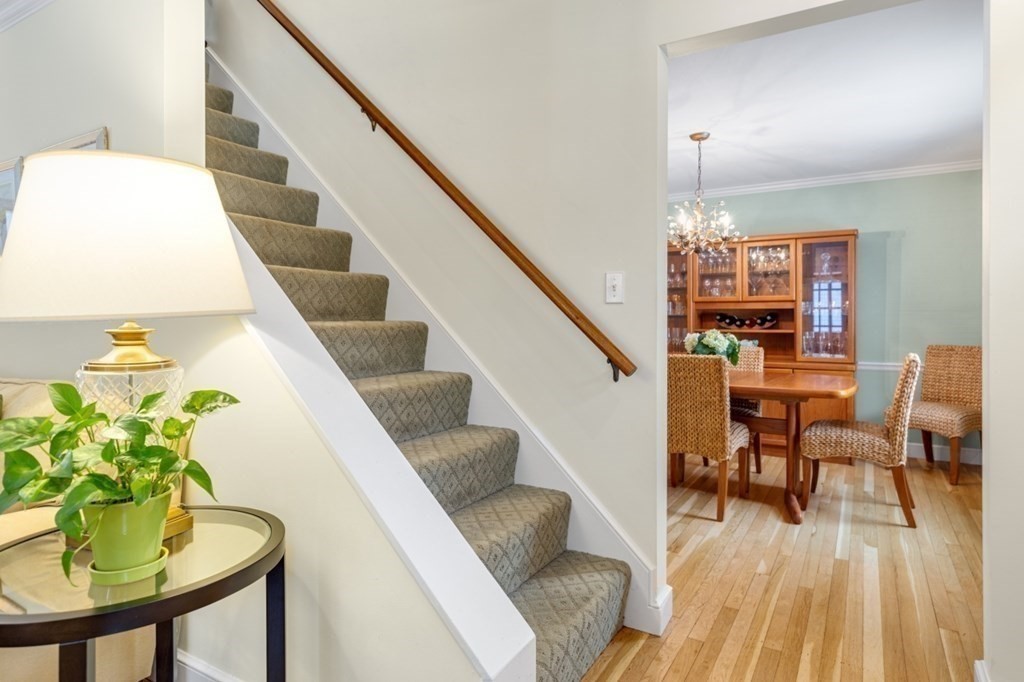 6 Sherman's Bridge Road Wayland, MA 01778 - Photo 19 of 42 a living room with furniture and a table