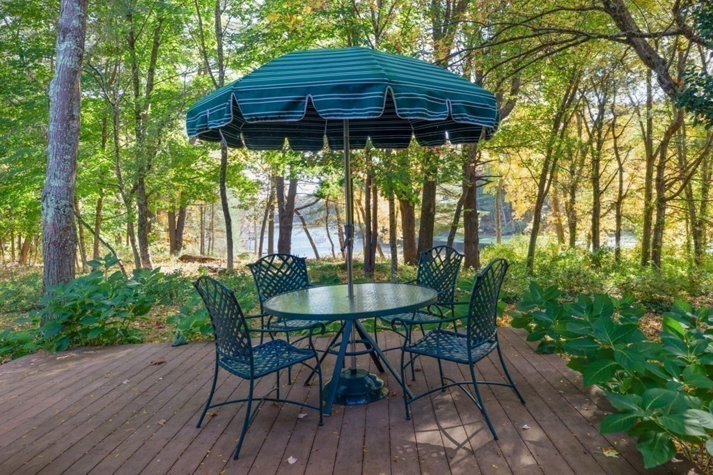 6 Sherman's Bridge Road Wayland, MA 01778 - Photo 32 of 42 a view of a table and chairs in patio