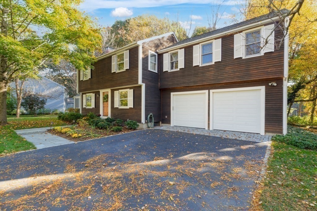6 Sherman's Bridge Road Wayland, MA 01778 - Photo 38 of 42 a front view of a house with garden