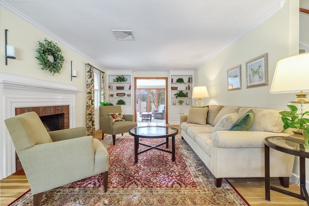 6 Sherman's Bridge Road Wayland, MA 01778 - Photo 4 of 42 a living room with furniture and a fireplace