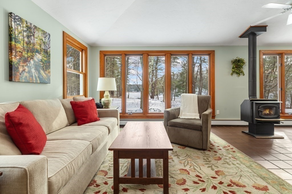 6 Sherman's Bridge Road Wayland, MA 01778 - Photo 10 of 42 a living room with furniture and a floor to ceiling window