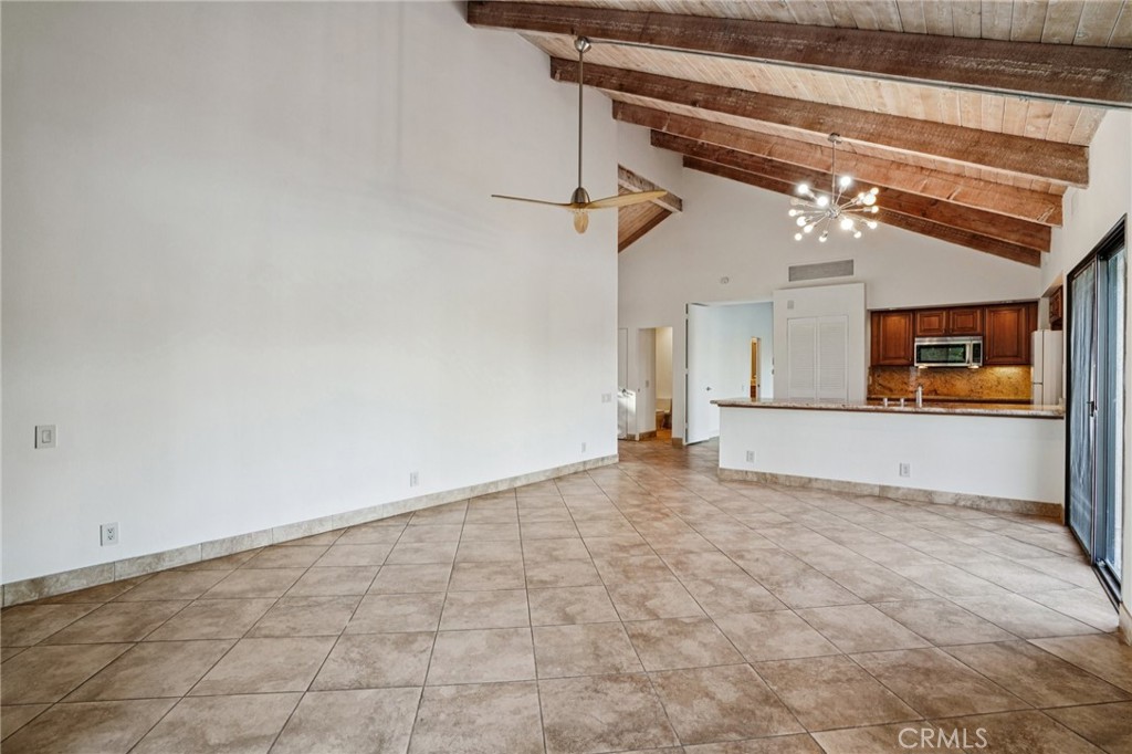 380 Wimbledon Drive Rancho Mirage, CA 92270 - Photo 11 of 41 a view of a hallway with a refrigerator and a stove top oven