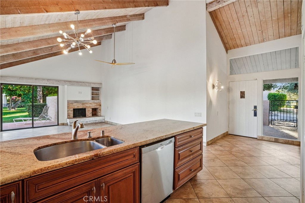 380 Wimbledon Drive Rancho Mirage, CA 92270 - Photo 16 of 41 a kitchen with a sink and a refrigerator