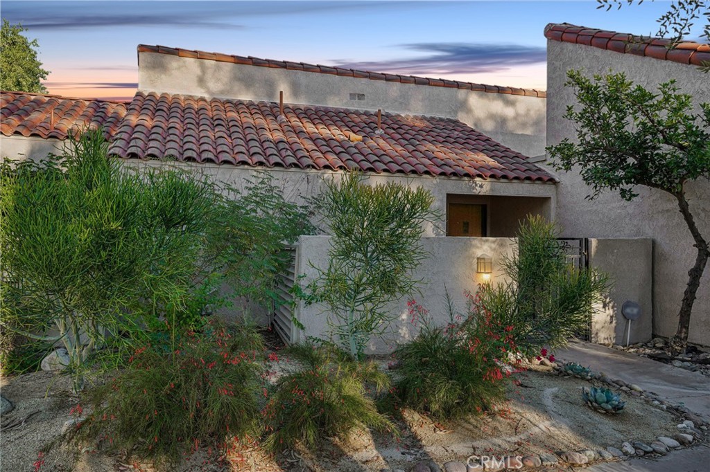 380 Wimbledon Drive Rancho Mirage, CA 92270 - Photo 2 of 41 a view of a house with a yard