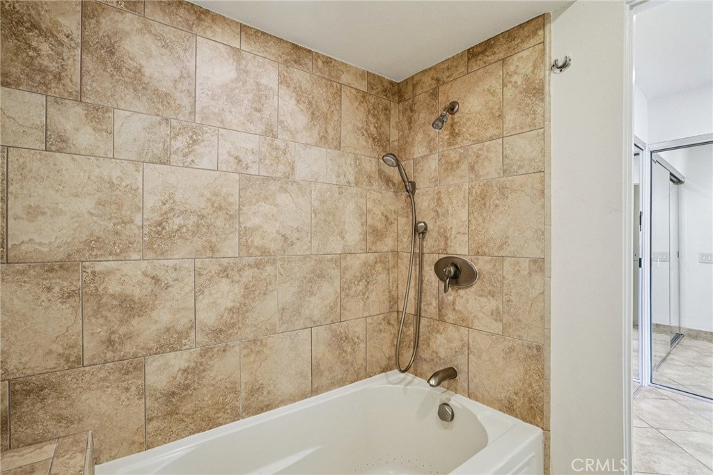 380 Wimbledon Drive Rancho Mirage, CA 92270 - Photo 26 of 41 a bathroom with a bathtub and shower