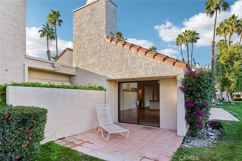 380 Wimbledon Drive Rancho Mirage, CA 92270 - Photo 33 of 41 front view of a house with a yard
