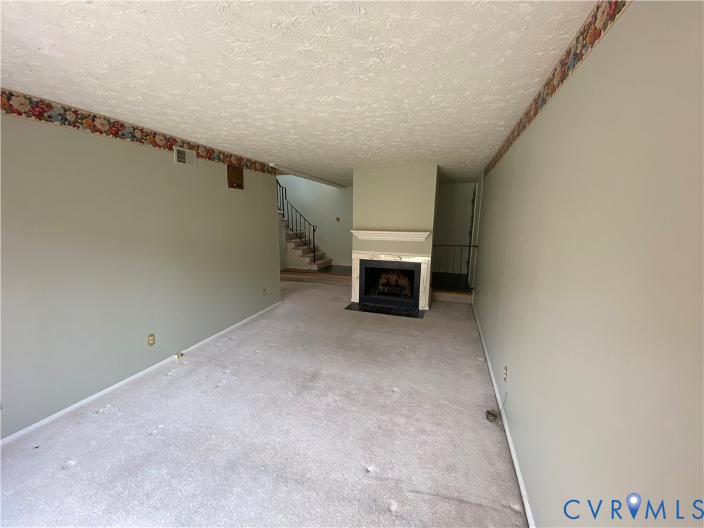 1507 Bronwyn Road, Unit 301 Henrico, VA 23238 - Photo 7 of 41 a view of empty room with fireplace