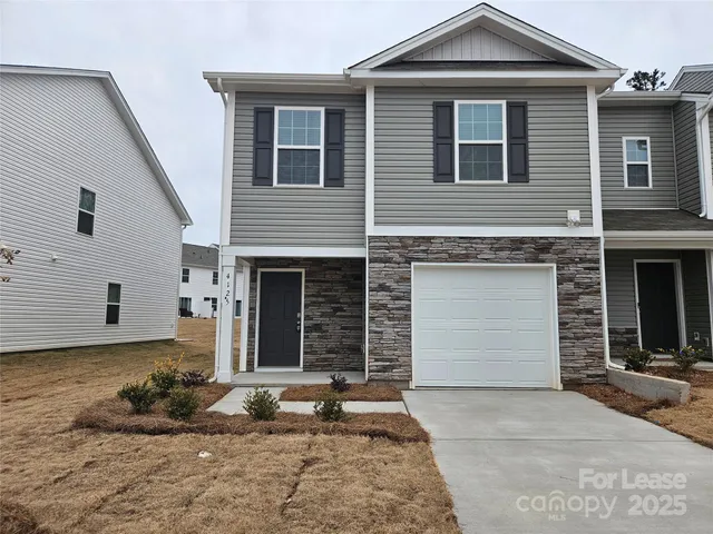 a front view of a house with a garage