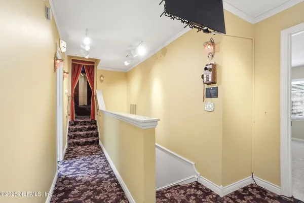 a bed room with a bed mirror and a window