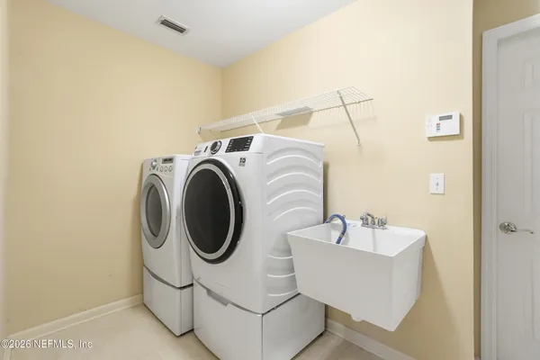 a view of a garden with a bench in the garden