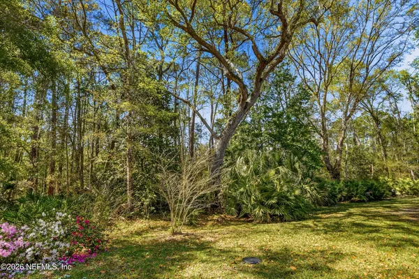 a view of a backyard with sitting area