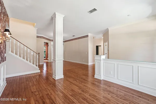 a view of entryway with wooden floor