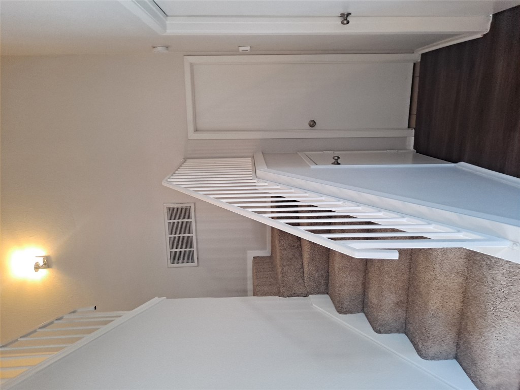 2018 West Rundberg Lane, Unit 9B Austin, TX 78758 - Photo 13 of 23 Staircase with wood finished floors and baseboards
