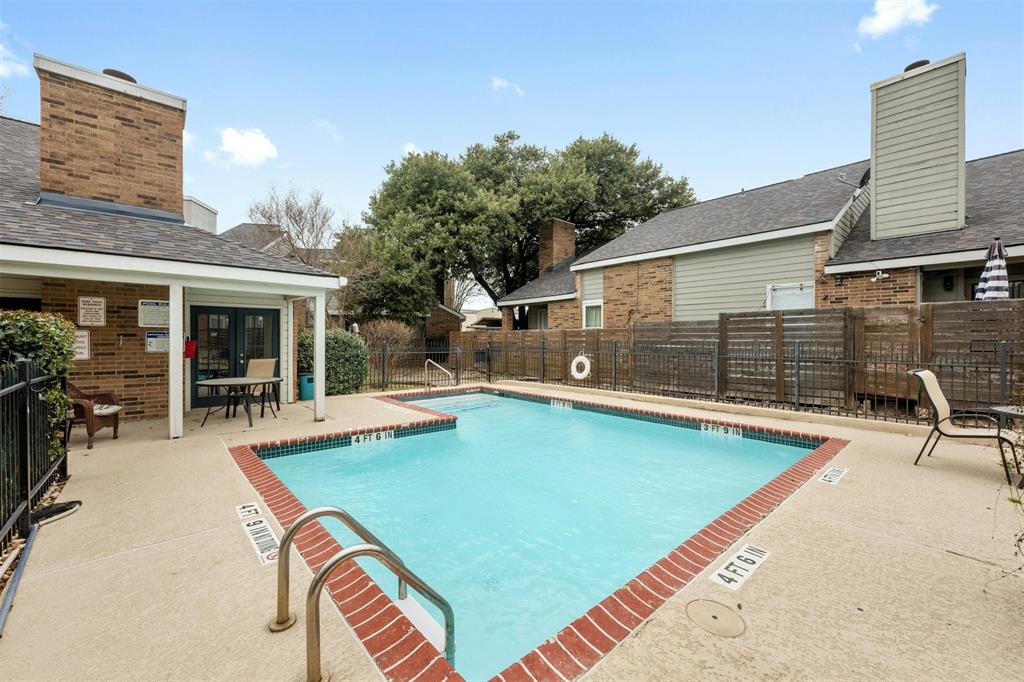 2018 West Rundberg Lane, Unit 9B Austin, TX 78758 - Photo 22 of 23 Community pool with a patio area and a fenced backyard