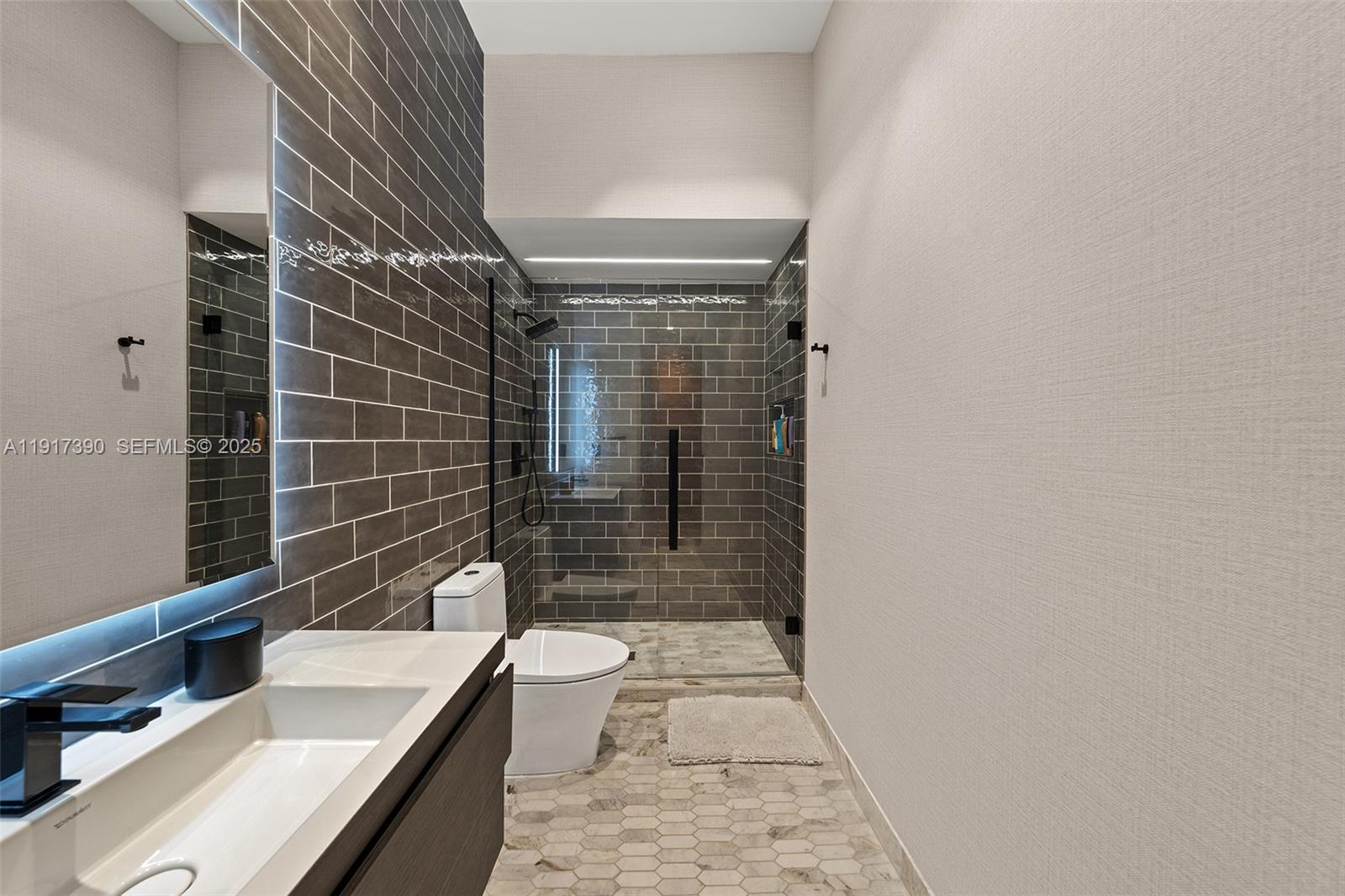 900 Washington Street Hollywood, FL 33019 - Photo 19 of 61 a bathroom with a sink a toilet and shower
